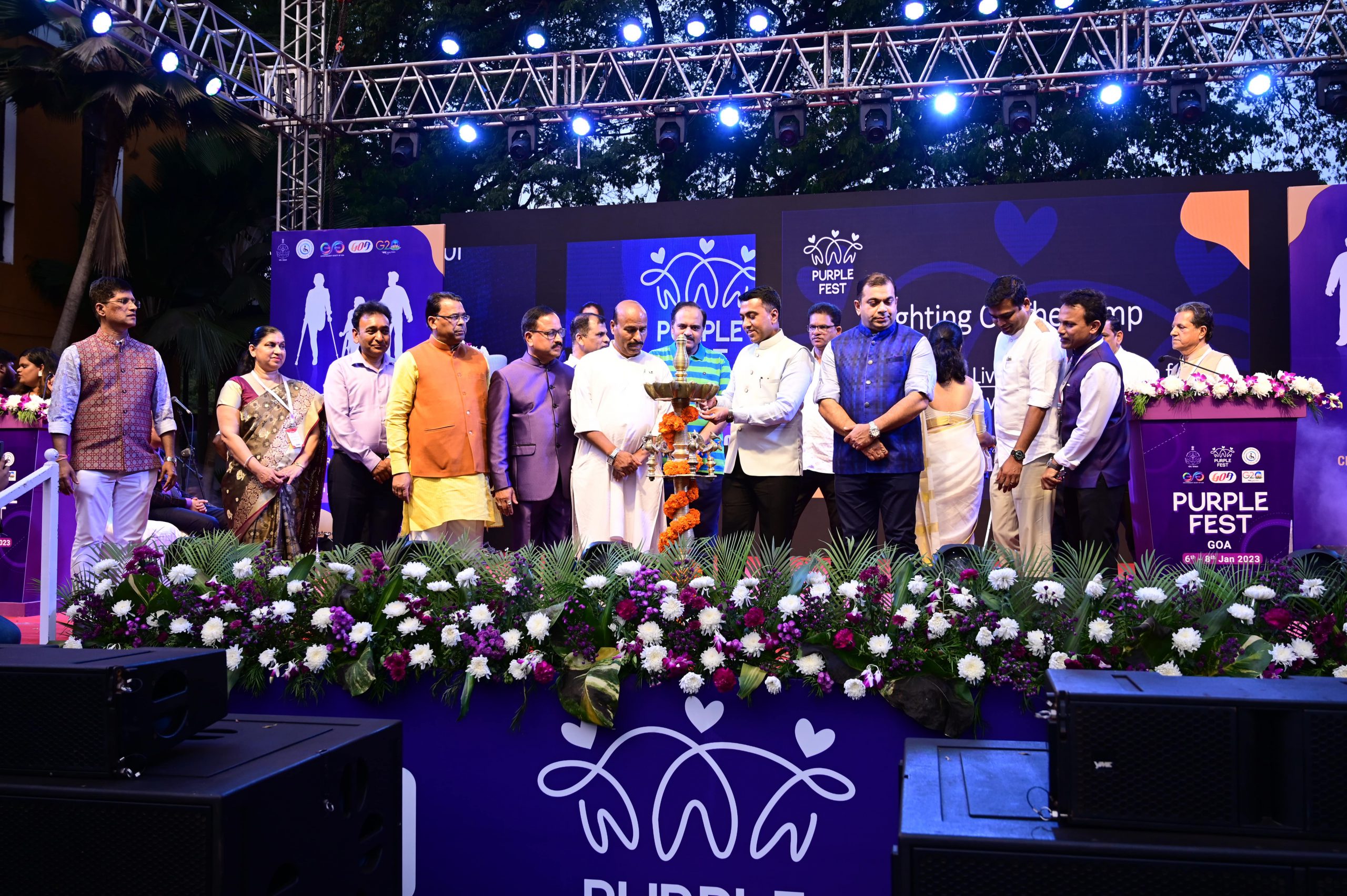 Hon'ble Goa CM Dr. Pramod Sawant while lighting the lamp at the opening ceremony of the Purple Fest in the presence of Dr. Virendra Kumar, Hon'ble Union Minister of Social Justice and Empowerment, Shri. Subhash Phal Dessai, Hon'ble Minister for Social Welfare and other dignitaries.